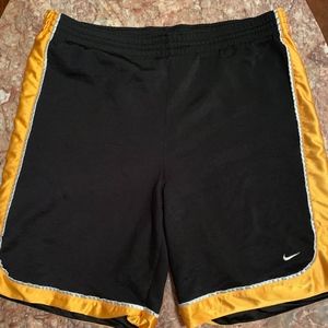 Black and gold Nike athletic shorts